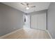Bedroom with ceiling fan and double-door closet at 11162 Libby Rd, Spring Hill, FL 34609