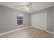 Bedroom with ceiling fan and window with blinds at 11162 Libby Rd, Spring Hill, FL 34609