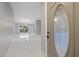 Elegant entryway with glass door and tiled floor at 11162 Libby Rd, Spring Hill, FL 34609