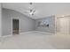 Spacious living area with large windows and high ceilings at 11162 Libby Rd, Spring Hill, FL 34609
