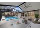Relaxing pool area with covered patio and seating at 11162 Libby Rd, Spring Hill, FL 34609
