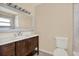 Updated bathroom with a vanity, toilet and mirror at 11408 Midfield Way # 11408, Tampa, FL 33624