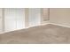 Carpeted bedroom with double closets and a window at 11408 Midfield Way # 11408, Tampa, FL 33624