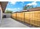 Private patio with wood fence and concrete flooring at 11408 Midfield Way # 11408, Tampa, FL 33624