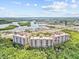 Aerial view of condo community overlooking a marina and scenic bay, blending luxury with nature at 12033 Gandy N Blvd # 145, St Petersburg, FL 33702