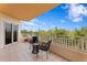 Charming condo balcony with tile flooring and relaxing outdoor furniture with tree views at 12033 Gandy N Blvd # 145, St Petersburg, FL 33702