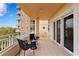 Relaxing condo balcony with outdoor seating offering expansive views and natural light at 12033 Gandy N Blvd # 145, St Petersburg, FL 33702