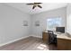 Bedroom with desk, chair, and hardwood floors at 12033 Gandy N Blvd # 145, St Petersburg, FL 33702