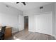 Bedroom with hardwood floors, bi-fold closet, and adjacent rooms at 12033 Gandy N Blvd # 145, St Petersburg, FL 33702