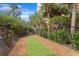 Pet-friendly community featuring an enclosed dog run area with artificial turf and shade trees at 12033 Gandy N Blvd # 145, St Petersburg, FL 33702
