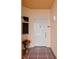 Inviting home entrance with a classic white door, tiled porch, and decorative potted flowers at 12033 Gandy N Blvd # 145, St Petersburg, FL 33702