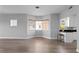 Bright and airy living room with modern flooring and large bay windows at 12033 Gandy N Blvd # 145, St Petersburg, FL 33702
