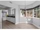 Bright living area with bar-style seating that overlooks the kitchen and beautiful window light at 12033 Gandy N Blvd # 145, St Petersburg, FL 33702