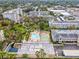 Drone view showcases community pool, shuffleboard, and grounds at 1235 S Highland Ave # 3-303, Clearwater, FL 33756