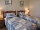 Twin bedroom with two beds and coordinating bedding at 1235 S Highland Ave # 3-303, Clearwater, FL 33756