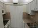 Kitchen boasting light wood cabinets, granite counters, and built-in microwave at 1235 S Highland Ave # 3-303, Clearwater, FL 33756
