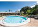 Community pool with plenty of lounge chairs at 1235 S Highland Ave # 3-303, Clearwater, FL 33756