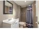 Modern bathroom with tiled walls, sleek vanity, and a shower with decorative curtain at 1303 S Hercules Ave # 1, Clearwater, FL 33764