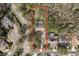 Aerial view highlighting the property with ample land and proximity to neighboring houses at 170 Greenhaven Cir, Oldsmar, FL 34677