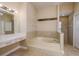 Elegant bathroom with a large soaking tub, vanity area, and a separate shower at 170 Greenhaven Cir, Oldsmar, FL 34677