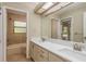 Bathroom features a double sink, quartz countertop, and shower at 170 Greenhaven Cir, Oldsmar, FL 34677