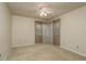 Bedroom features neutral carpet, a ceiling fan, and windows with curtains at 170 Greenhaven Cir, Oldsmar, FL 34677
