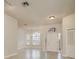 Elegant foyer with tile floors, a chandelier, and views of the front yard at 170 Greenhaven Cir, Oldsmar, FL 34677