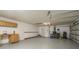 Spacious garage features ample storage space and a workbench at 170 Greenhaven Cir, Oldsmar, FL 34677