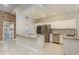 Spacious kitchen with white cabinets, stainless steel appliances and a breakfast bar at 170 Greenhaven Cir, Oldsmar, FL 34677