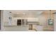 Modern kitchen featuring white cabinets, granite countertops and stainless steel appliances at 170 Greenhaven Cir, Oldsmar, FL 34677