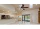 Bright living room with skylights, stainless appliances, and views of the pool at 170 Greenhaven Cir, Oldsmar, FL 34677