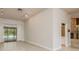 Bright and airy living room with tile floors and views of the pool through sliding glass doors at 170 Greenhaven Cir, Oldsmar, FL 34677