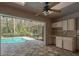 A pool with a screened-in patio and an outdoor kitchen area at 170 Greenhaven Cir, Oldsmar, FL 34677