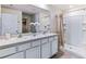 Elegant bathroom with double vanity and a large shower at 1708 Light Gardens Ave, Plant City, FL 33565