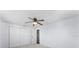 Bedroom with double door closet and ceiling fan at 2333 Tahitian Dr, Holiday, FL 34691