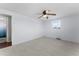 Bedroom with ceiling fan and access to bathroom at 2333 Tahitian Dr, Holiday, FL 34691