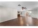 Living room with hardwood floors and access to screened porch at 2333 Tahitian Dr, Holiday, FL 34691