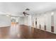 Spacious living room with hardwood floors and ceiling fans at 2333 Tahitian Dr, Holiday, FL 34691