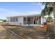Screened porch with tile flooring and storage at 2333 Tahitian Dr, Holiday, FL 34691