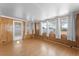Sunroom with wood paneling, windows, and door to outdoors at 2333 Tahitian Dr, Holiday, FL 34691