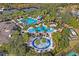 Aerial view of community pool, tennis courts, and other amenities at 2445 Silvermoss Dr, Wesley Chapel, FL 33544