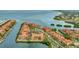 Expansive aerial shot of waterfront condos, lush landscapes, and a picturesque coastal setting at 2722 Via Tivoli # 432B, Clearwater, FL 33764