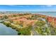 Breathtaking aerial view showcases the community's waterfront location and vibrant architecture at 2722 Via Tivoli # 432B, Clearwater, FL 33764