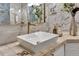 Detailed bathroom with white vessel sink, marble tiling, and gold fixtures at 2722 Via Tivoli # 432B, Clearwater, FL 33764
