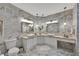 Elegant bathroom with double sinks, white cabinetry, and marble accents at 2722 Via Tivoli # 432B, Clearwater, FL 33764