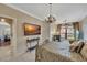 Stylish bedroom features flat screen tv, fireplace and marble flooring at 2722 Via Tivoli # 432B, Clearwater, FL 33764