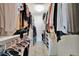 Walk-in closet with shelving for optimal clothing storage at 2722 Via Tivoli # 432B, Clearwater, FL 33764