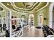 Bright gym with varied machines, free weights, ceiling fans, and plenty of space at 2722 Via Tivoli # 432B, Clearwater, FL 33764