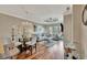 Open-concept living room and dining area with hardwood floors and elegant chandelier at 2722 Via Tivoli # 432B, Clearwater, FL 33764