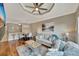 Comfortable living room with hardwood floors, fan, and views of the neighborhood at 2722 Via Tivoli # 432B, Clearwater, FL 33764